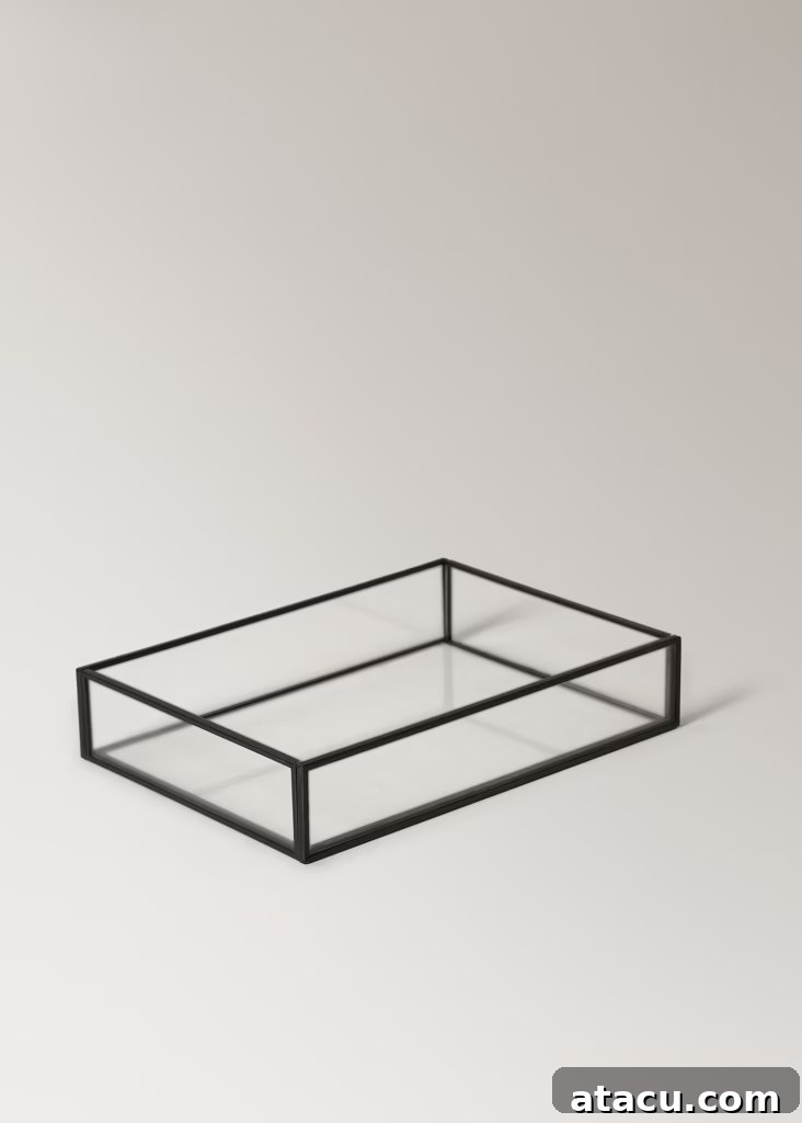 Close-up of a sleek small decorative tray, ideal for organizing and styling a living room table with elegance.