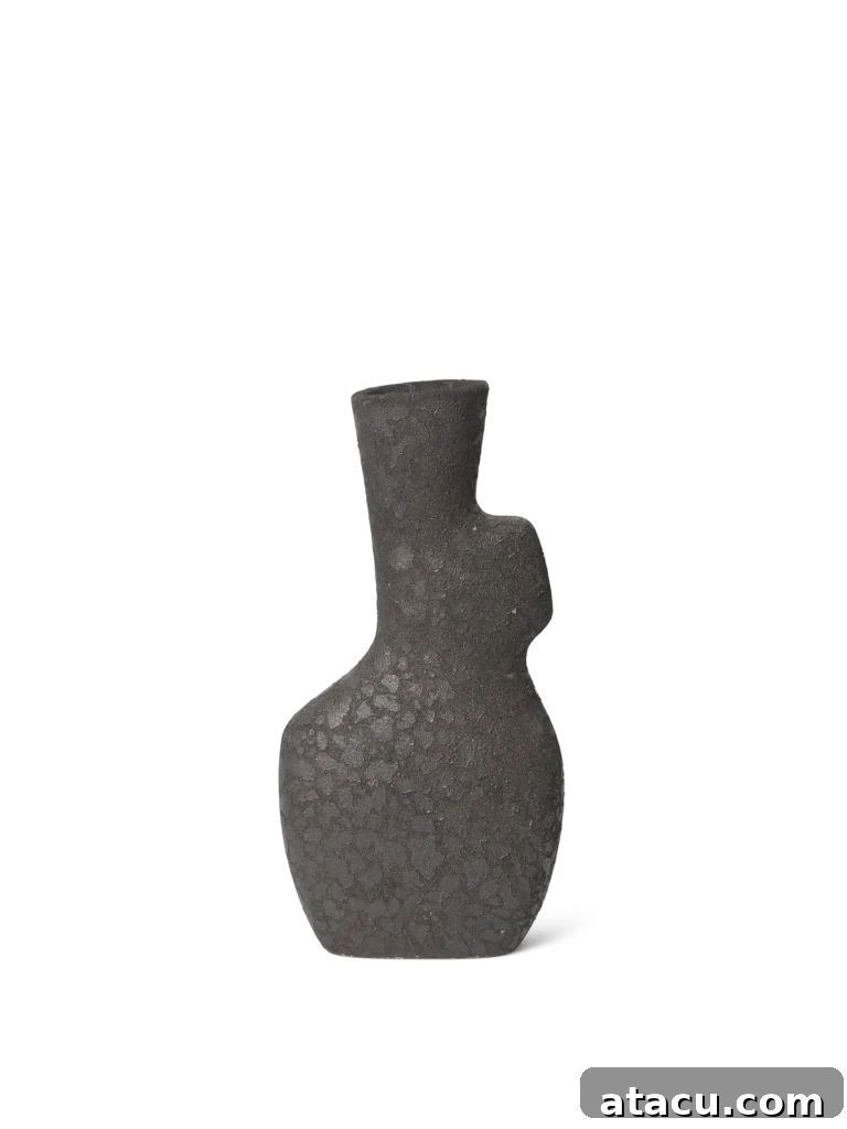 The distinctive design of the sculptural organic vase by Ferm Living, perfect as a standalone art piece or for displaying minimalist botanicals.
