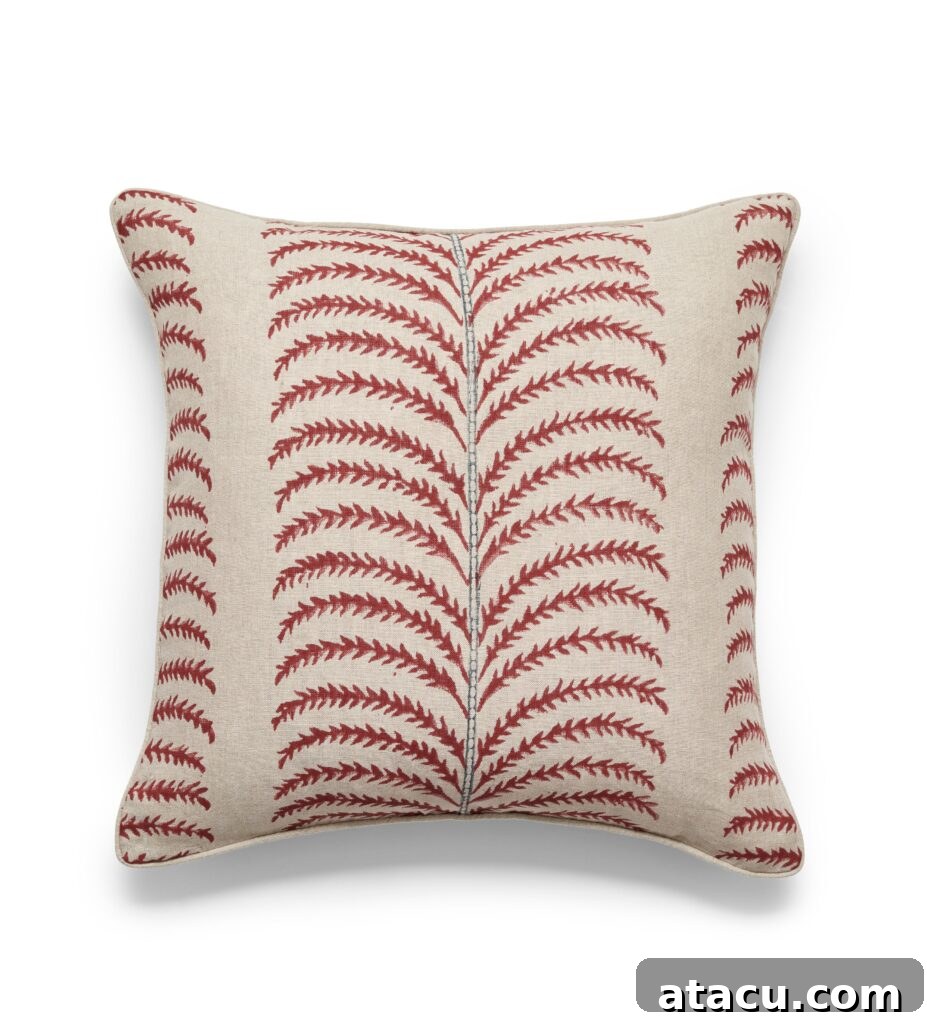 A vibrant Areca palm print cushion cover by Oka, showcasing detailed botanical design and rich texture.