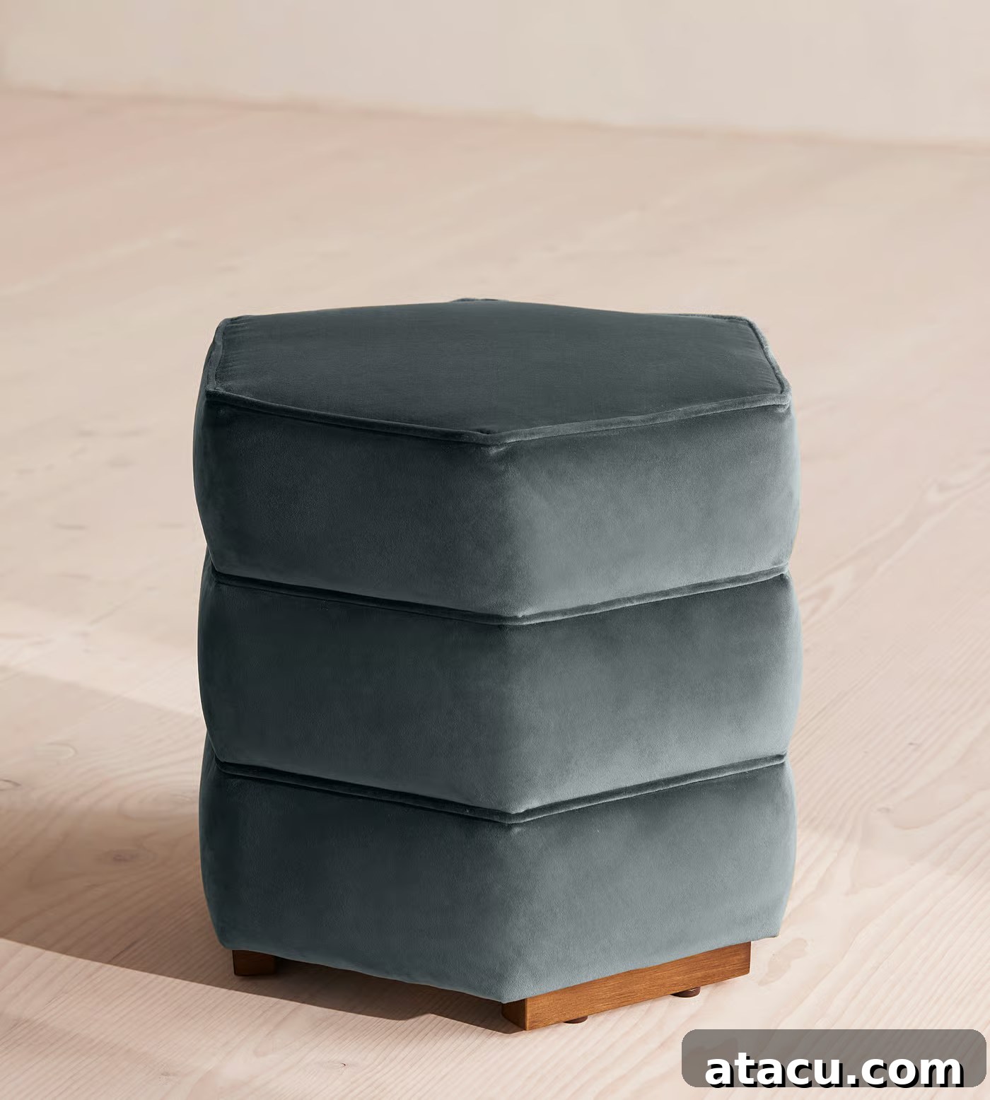 The luxurious Lyla blue velvet footstool by Soho Home, showcasing its elegant design and rich texture.