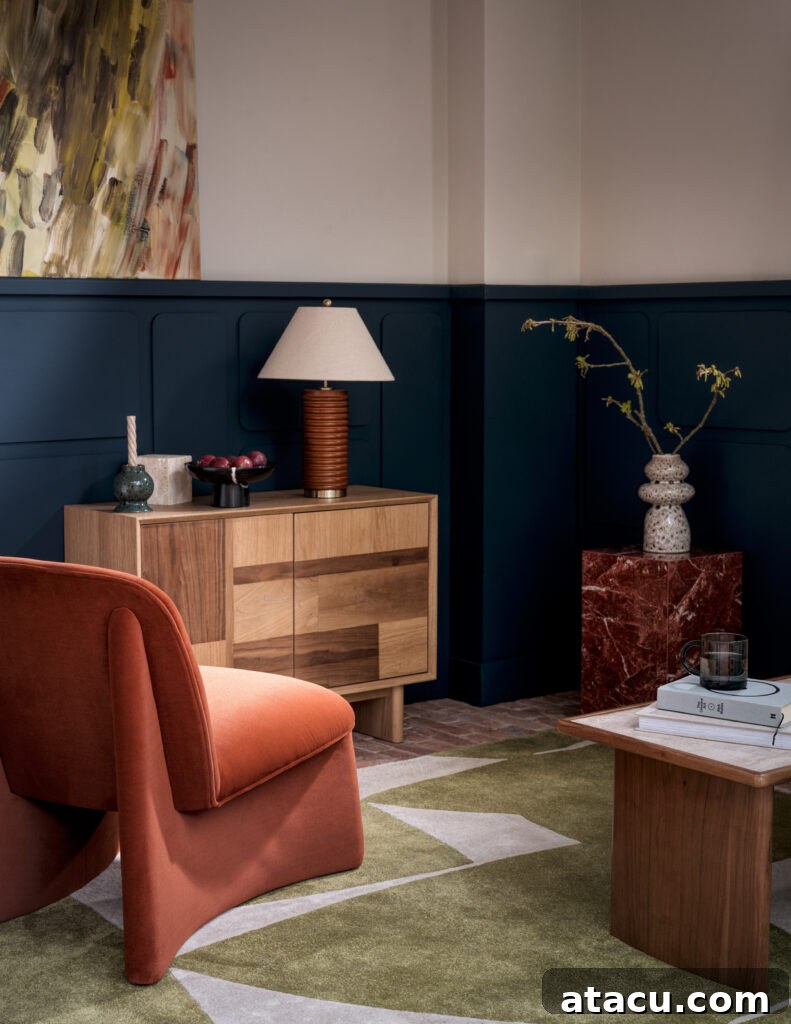Mid-century inspired reading nook with terracotta chair and wood sideboard.