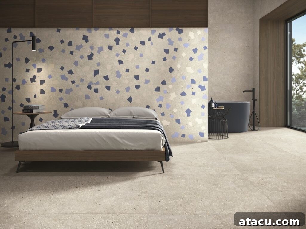 Grey porcelain floor tiles in a modern bedroom with terrazzo accent wall.
