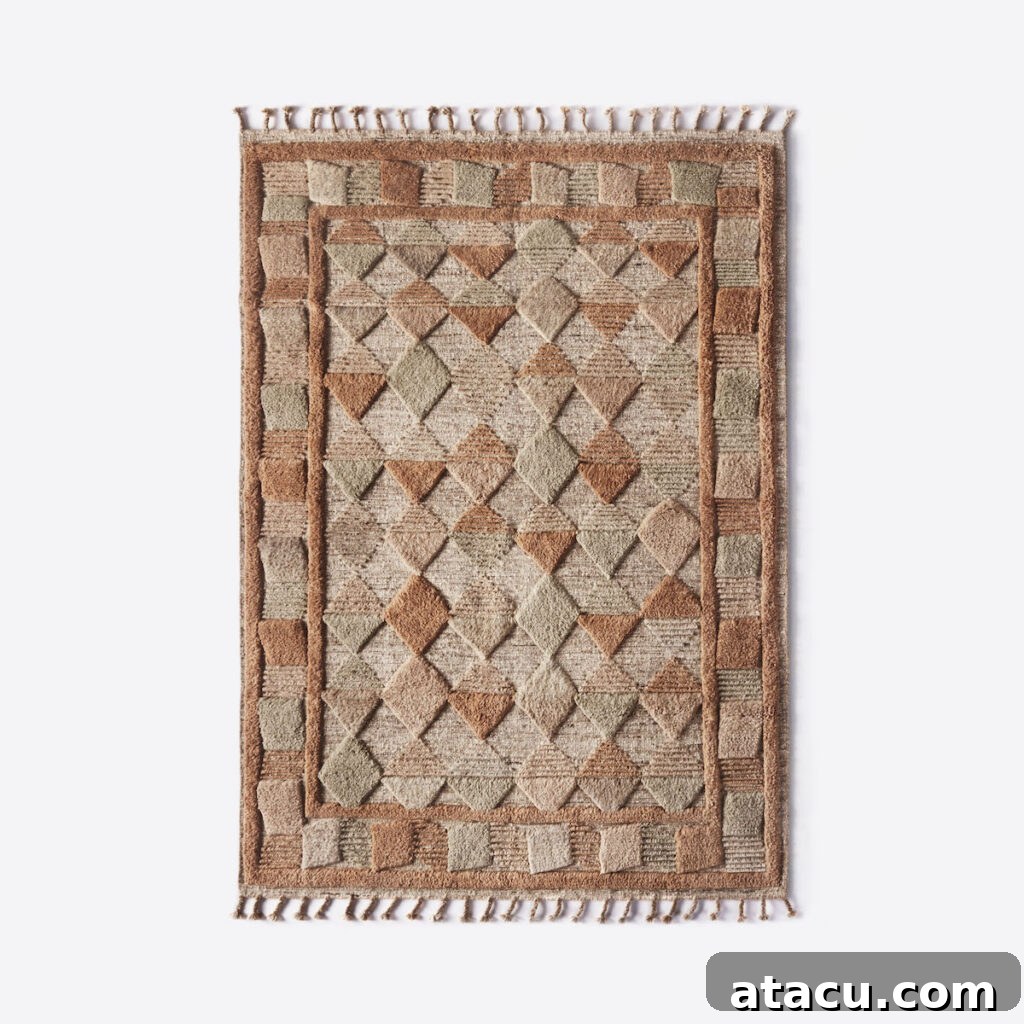 Detail of a hand-woven wool rug with subtle texture and natural fibers, complementing minimalist decor.