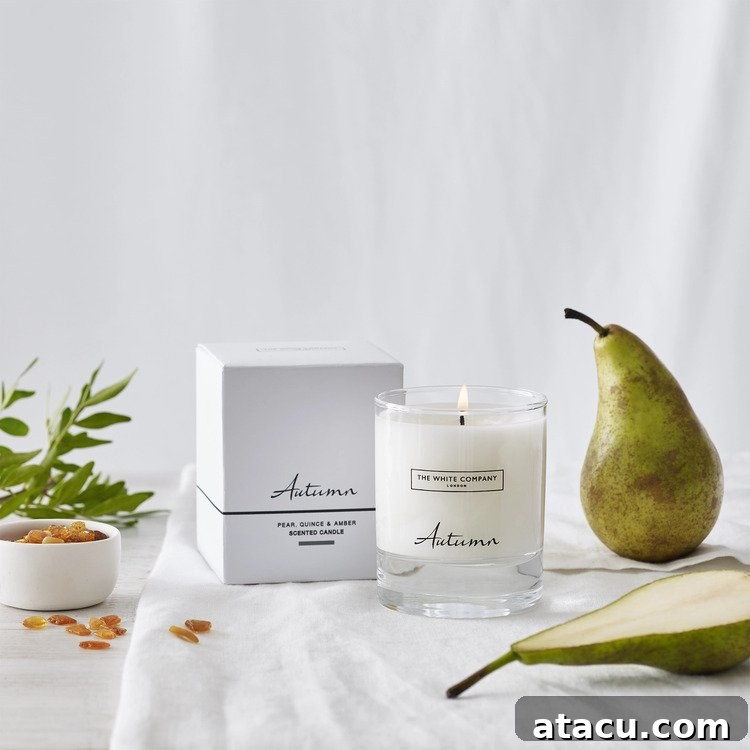 The White Company Autumn candle with a warm glow