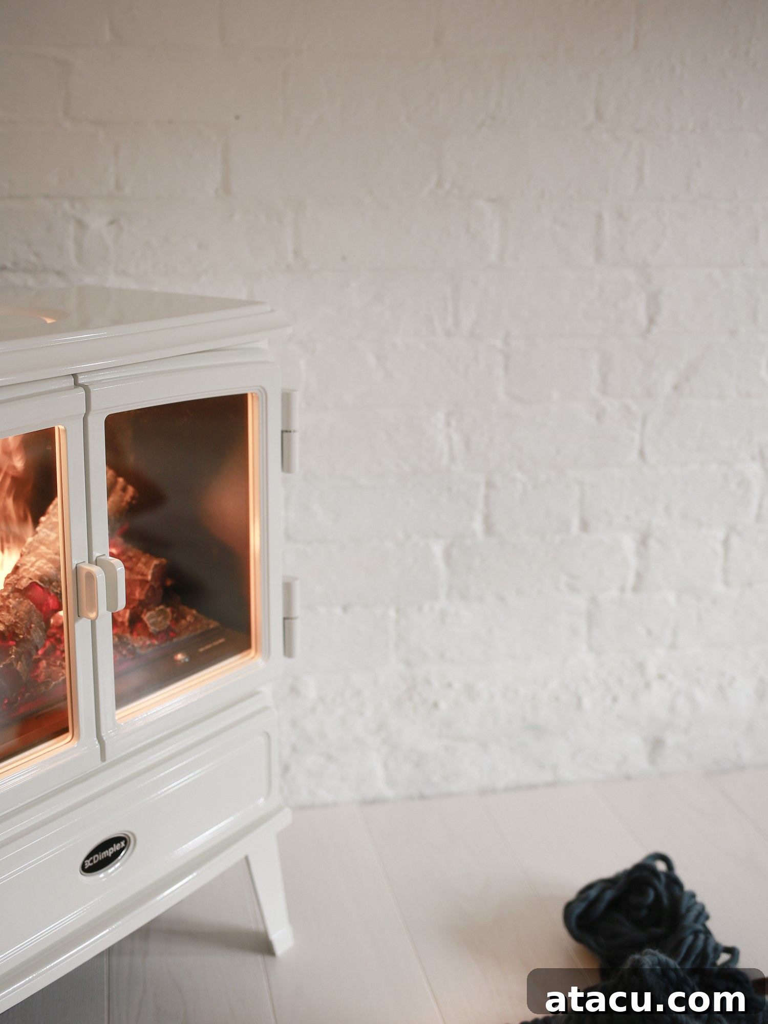 Dimplex Opti-myst stove adding warmth and style to a bright corner of a studio