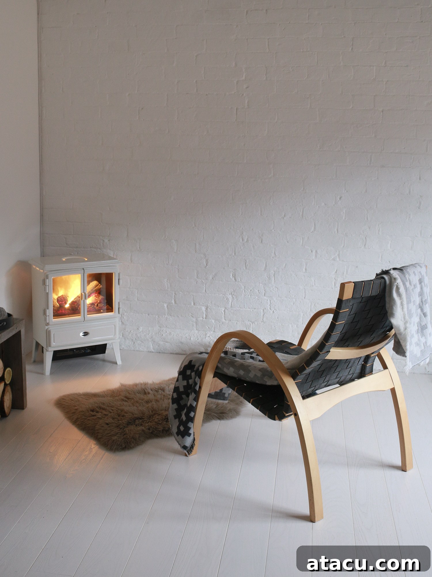 A modern electric stove with realistic fire effect placed in a contemporary home interior