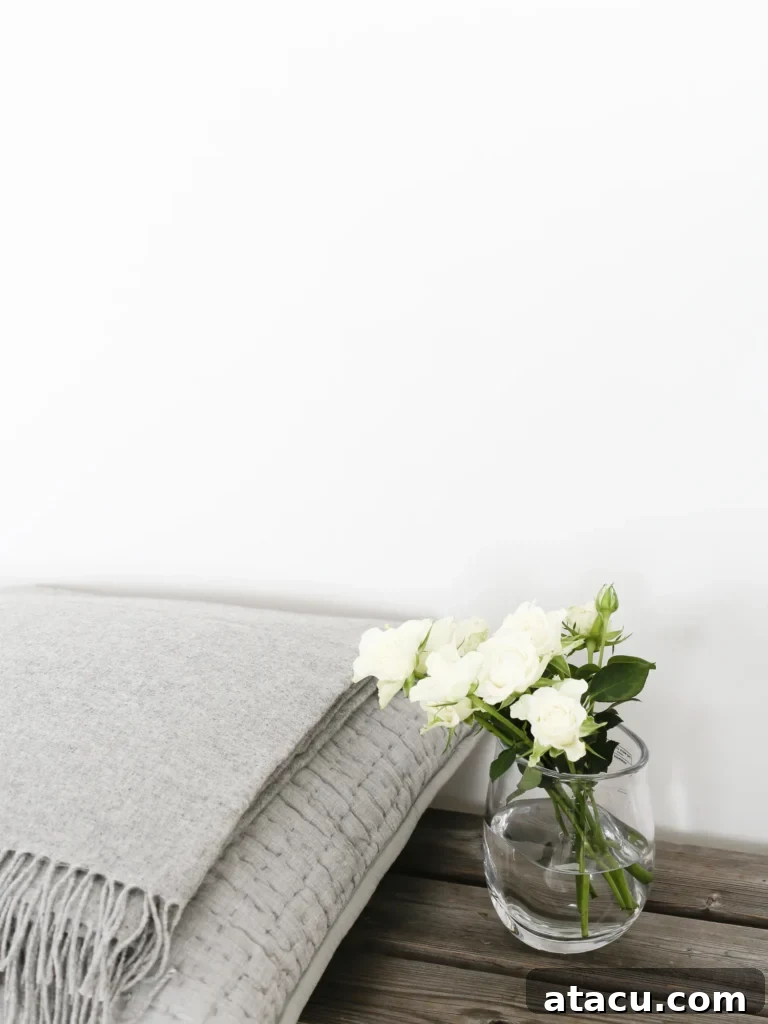 Another perspective of a clear glass vase with a fresh flower arrangement, highlighting its simplicity and natural beauty.