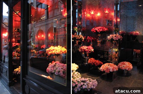 Close-up of an elegant floral arrangement showcasing roses and various blooms in a luxury Paris shop window
