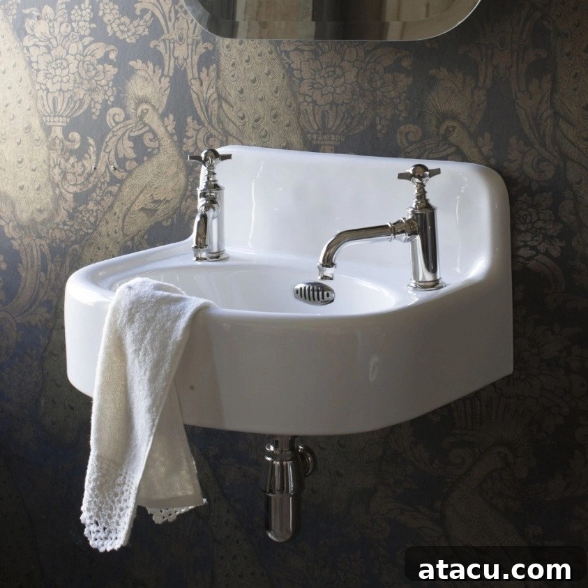 Best sinks for small bathrooms - an elegant wall hung cloakroom basin.