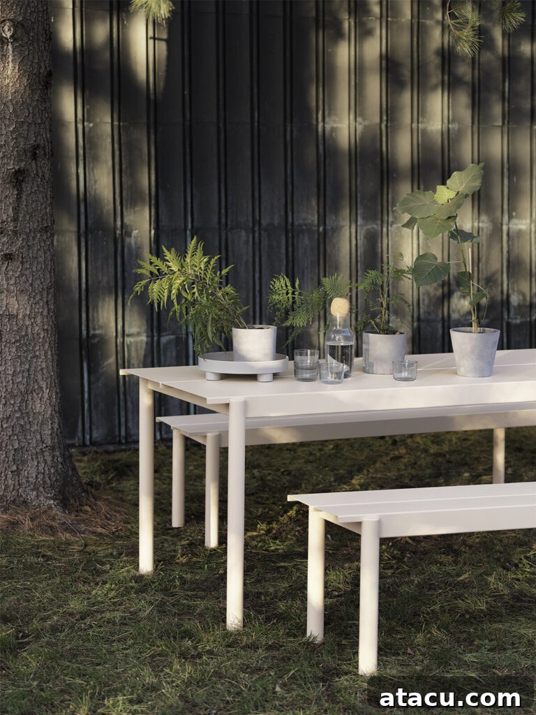 Upgrade Your Outdoors: 10 Best Dining Sets for 2024 2 An elegant outdoor table set for alfresco dining, featuring modern design and comfortable seating, ideal for stylish garden gatherings.