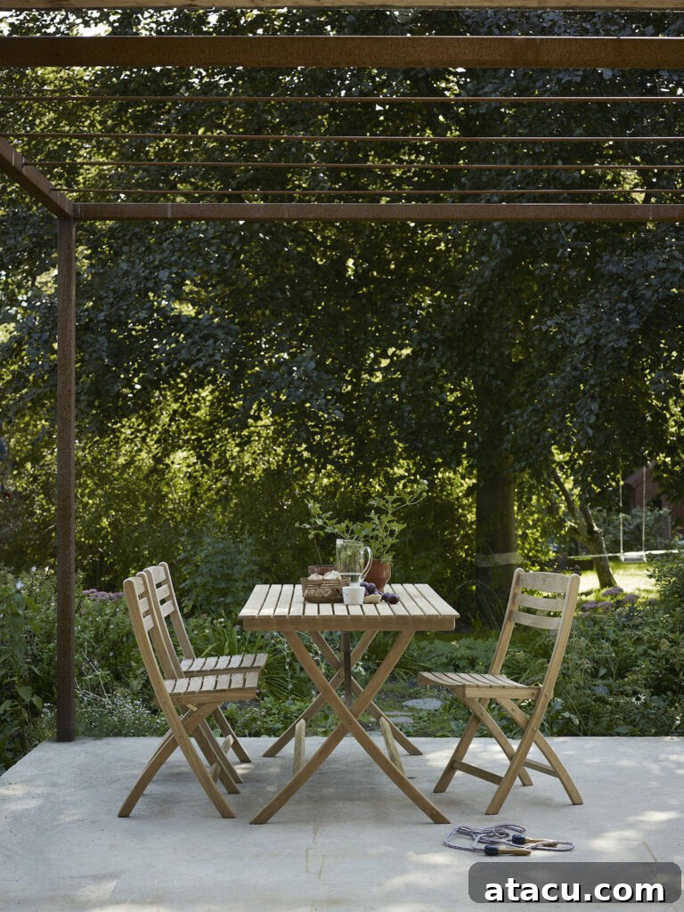 Upgrade Your Outdoors: 10 Best Dining Sets for 2024 11 A beautiful wooden outdoor dining table and chairs, designed for comfort and natural elegance in any garden setting.