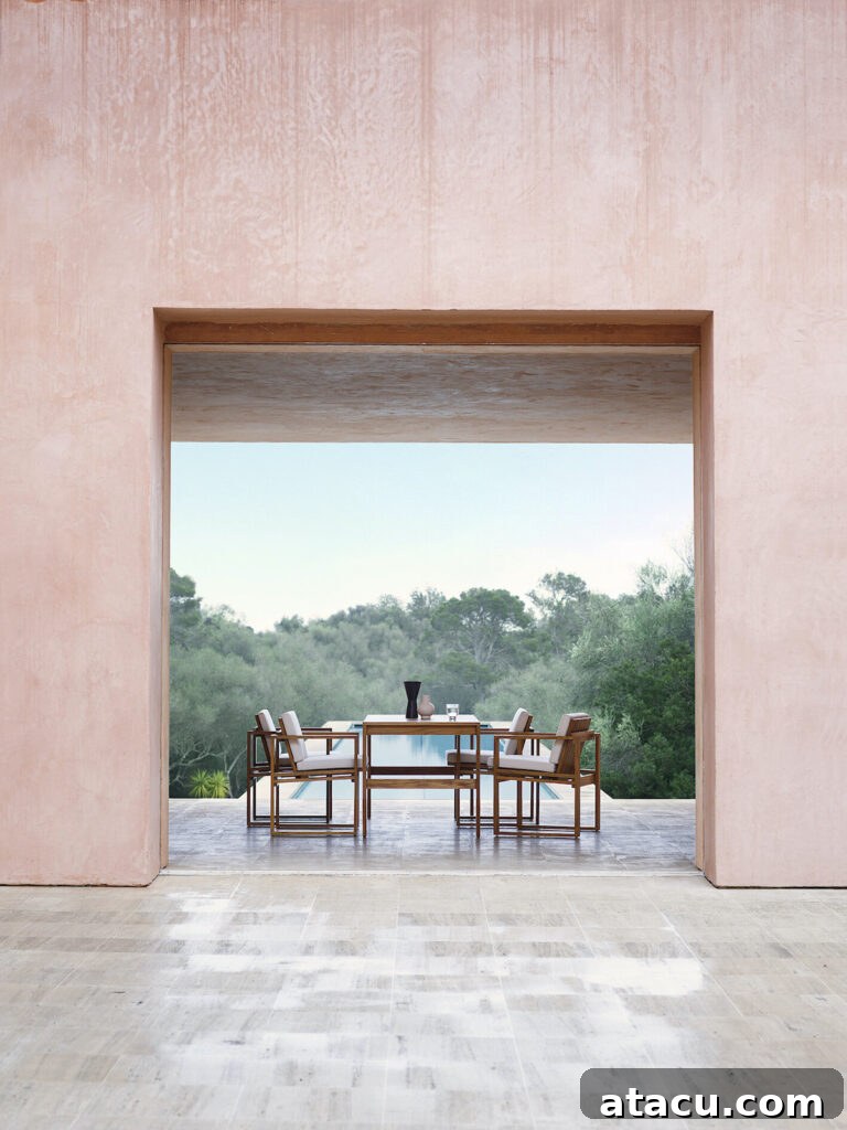 Upgrade Your Outdoors: 10 Best Dining Sets for 2024 3 An exquisite teak dining table and chairs ensemble set in an elegant outdoor space, showcasing natural beauty and timeless design.