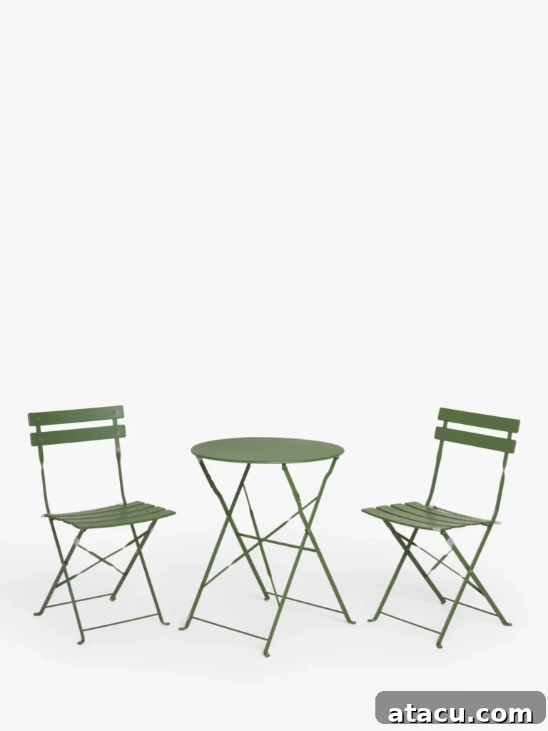 Upgrade Your Outdoors: 10 Best Dining Sets for 2024 6 A vibrant green bistro-style outdoor dining set, perfectly sized for intimate meals on a small patio or balcony.