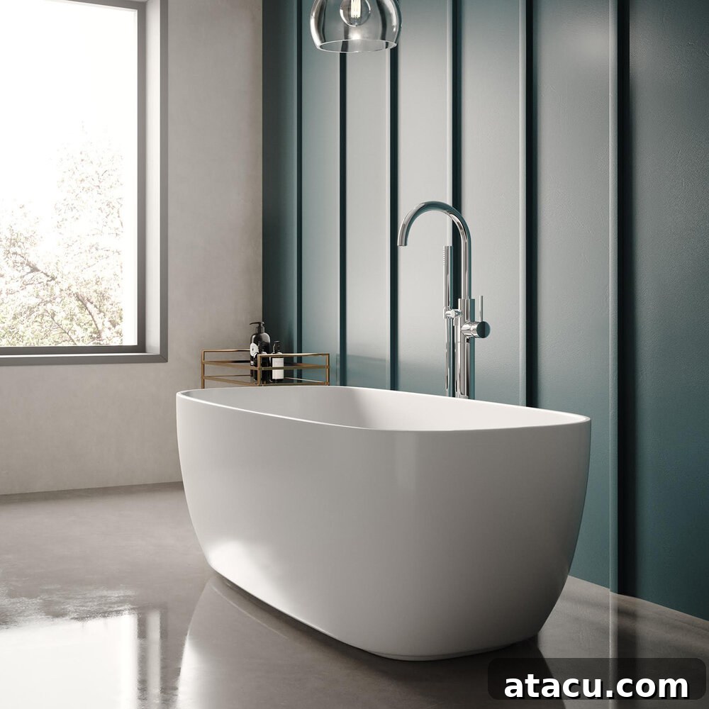 A freestanding bath in a blue bathroom.